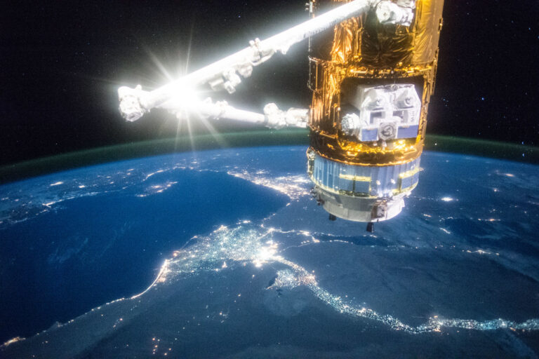 Japan's HTV-5 cargo craft is illuminated with the Nile river below